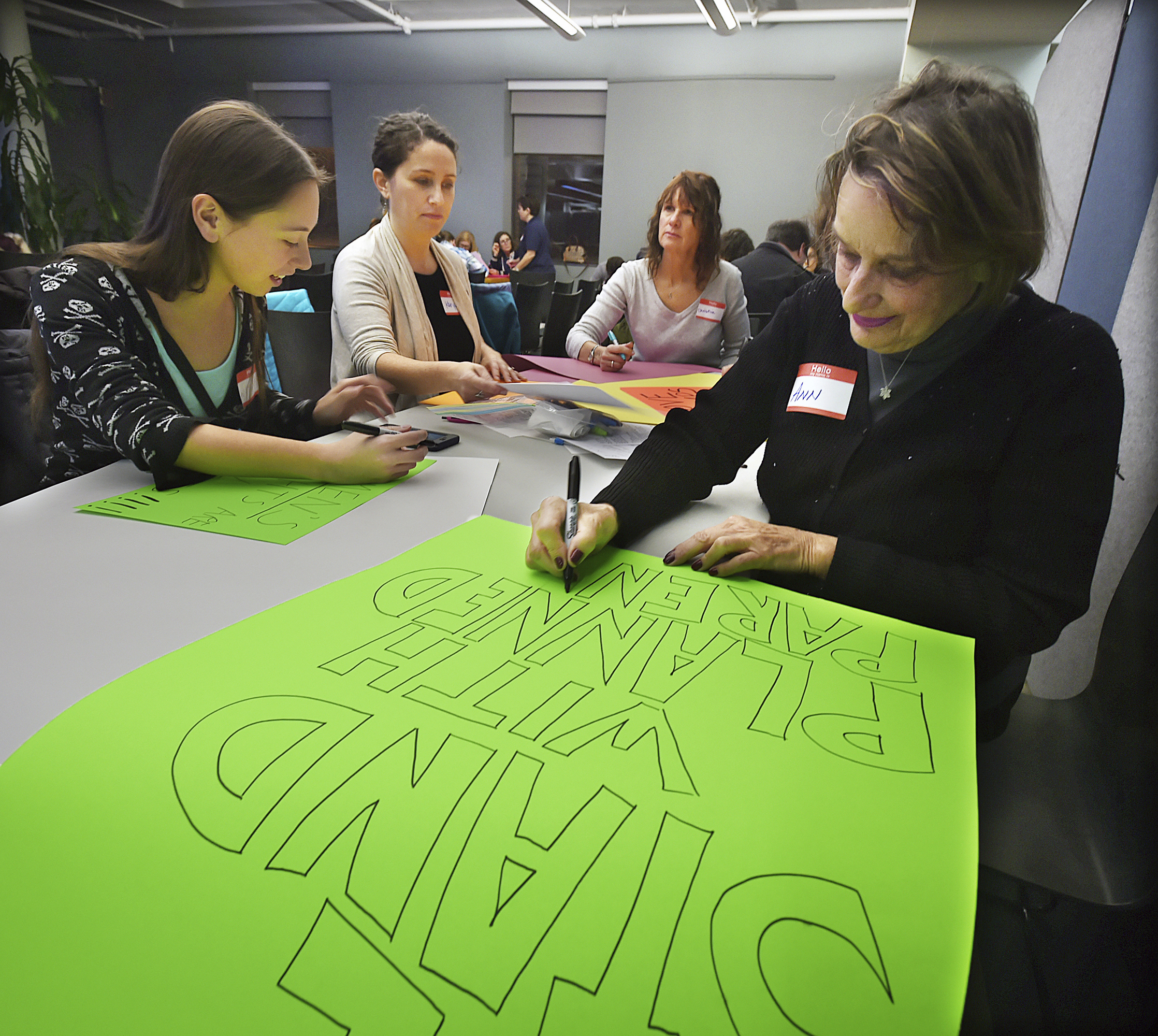 Members of the Connecticut chapter of the National Organization for Women prepare for the Women’s March on Washington. People from across the country plan to participate.