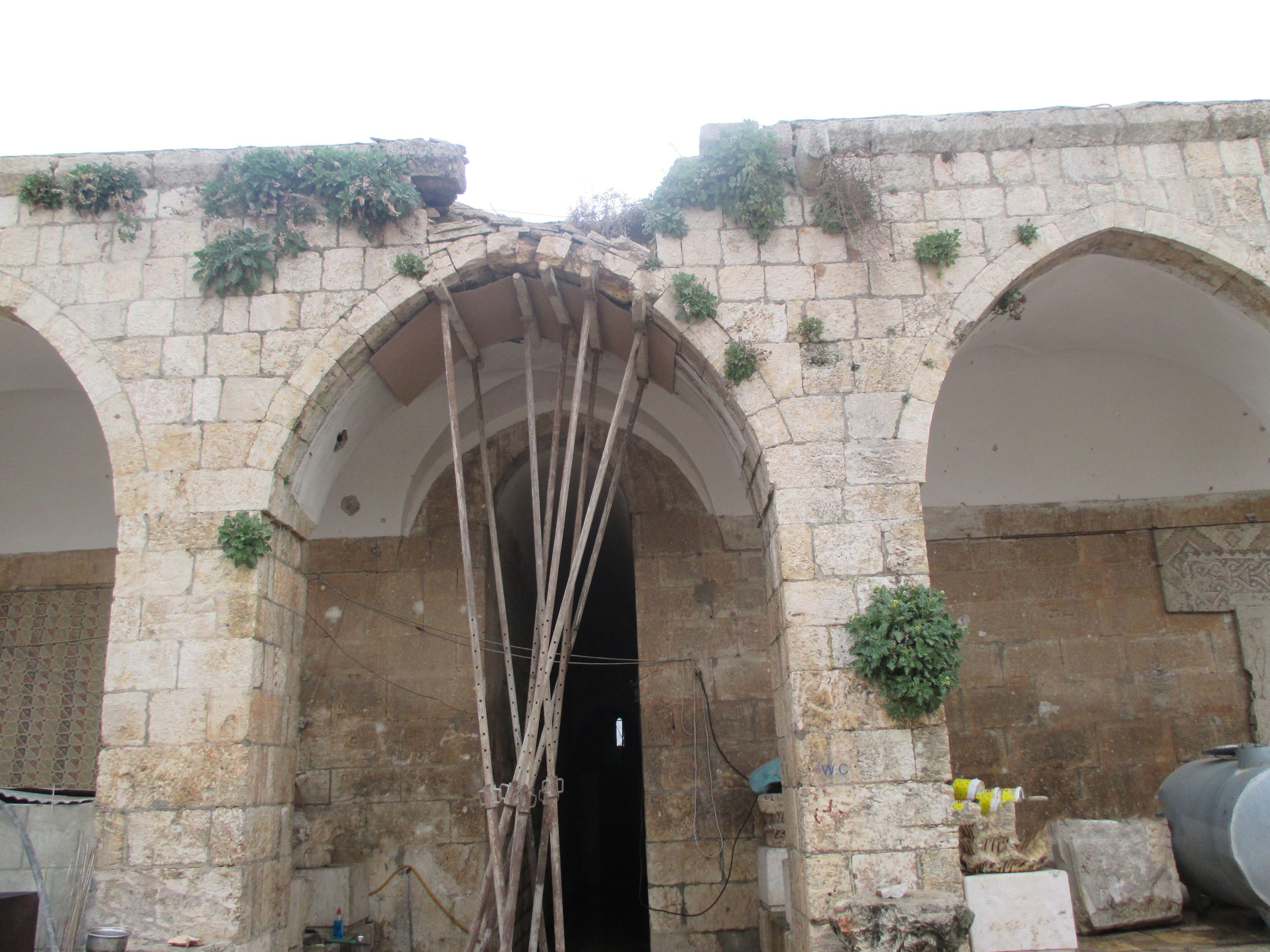 Syrian volunteers worked to repair and fortify damage to the roof of the Maโarra Museum to prevent further deterioration and possible collapse.