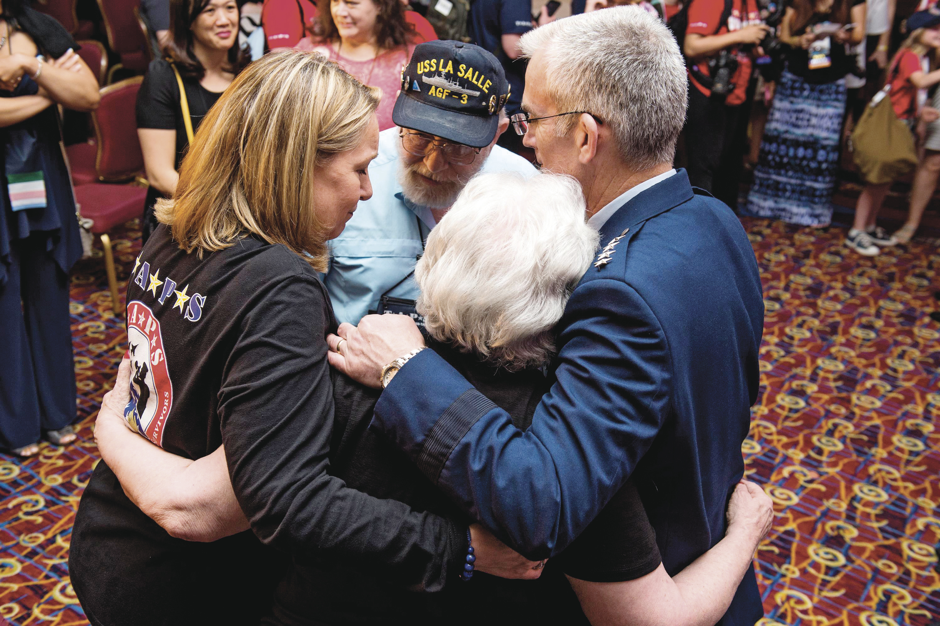 Bonnie Carroll of TAPS and Gen. Paul Selva (right) embrace the parents of Ronald Hemenway, who died at the Pentagon on September 11.