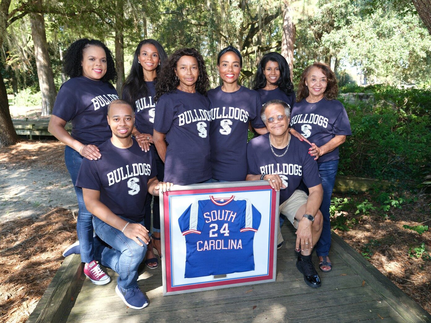 Tycely Williams and her family gathered at South Carolina State University in 2020 for the posthumous induction of her father, Tyrone Williams, Sr., into the university’s Athletics Hall of Fame. L to R: First Row: Tyrone Williams, II (brother)/kneeling, Jerona A. Williams (mother), self, Herman Willams (uncle) Second Row: Traci Williams (cousin), Tyrenda Williams Reed (sister), Tyra Williams-Pickens (sister) &amp; Mary Matthews (step-mother). 