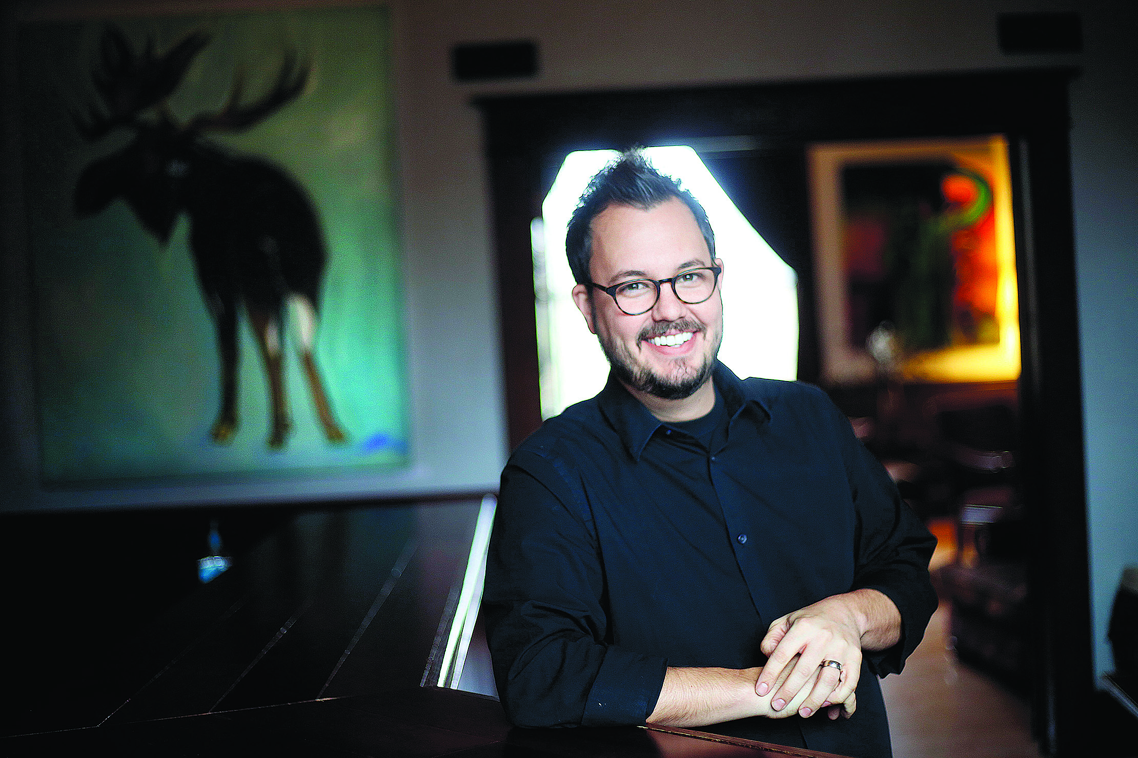 A TOAST TO DOING GOOD - Ryan Saari and members of his Oregon Community church joined local residents in opening a pub that donates after-cost proceeds to charities chosen by patrons. 