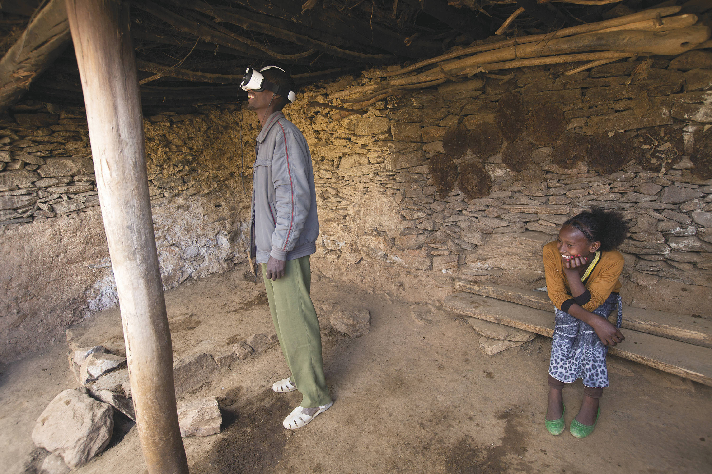 A STORY OF HOME: Alem Hailu Behalu watches a virtual-reality film created by Charity: Water that tells the story of his village in Ethiopia getting clean water. The video’s main character is his daughter Salem.