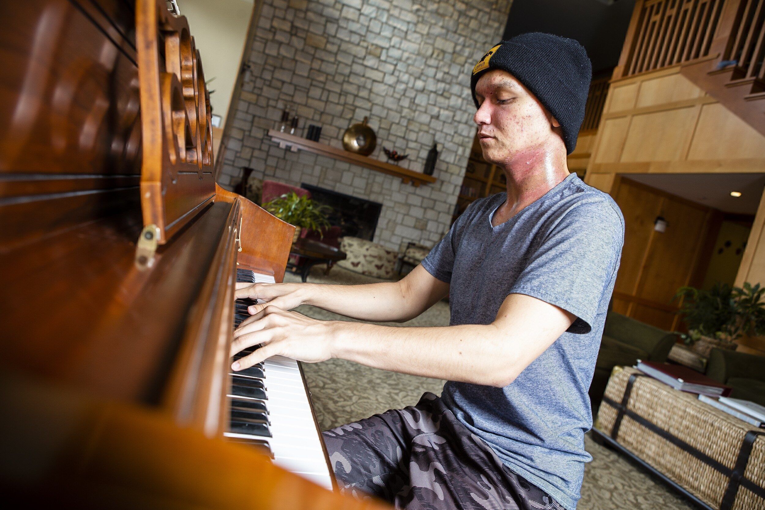 Tristan Hendler playing the piano in the Living Room at Ronald McDonald House near Central DuPage Hospital (Winfield, IL) filling the House with music that everyone loved. (Photo by Hilary Higgins)