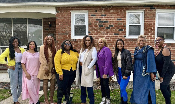 Members and supporters of Hey Auntie! pose for a photo during a Women’s History Month gathering to share and celebrate stories of the life legacies of women, both those who paved the way and the ones who are building now. 
