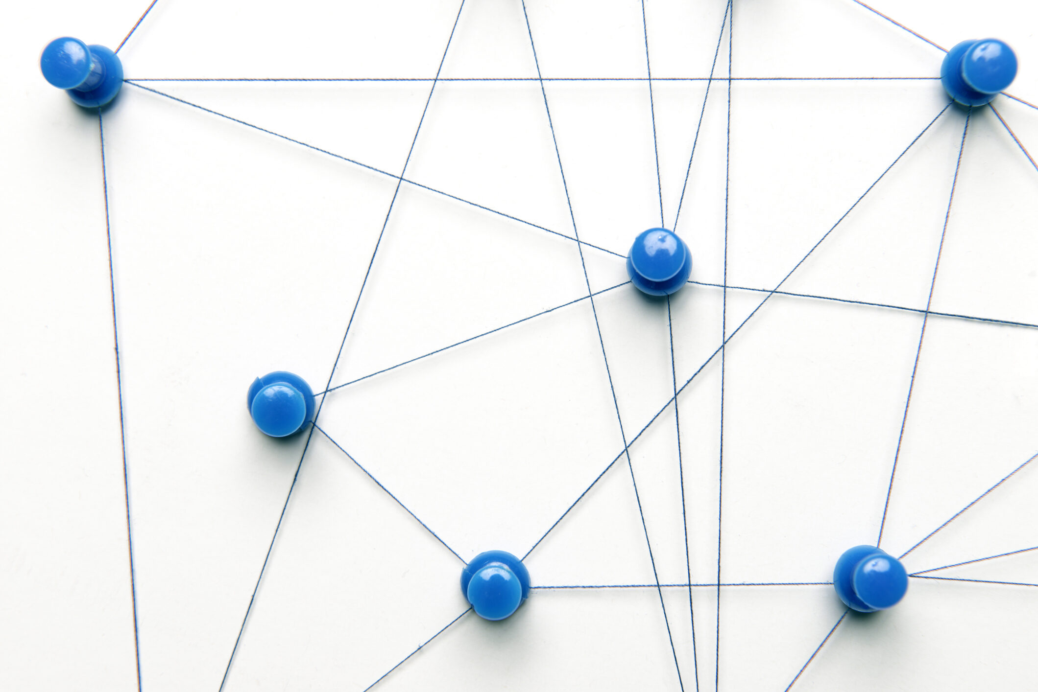 Blue pins connected via blue strings on white background.