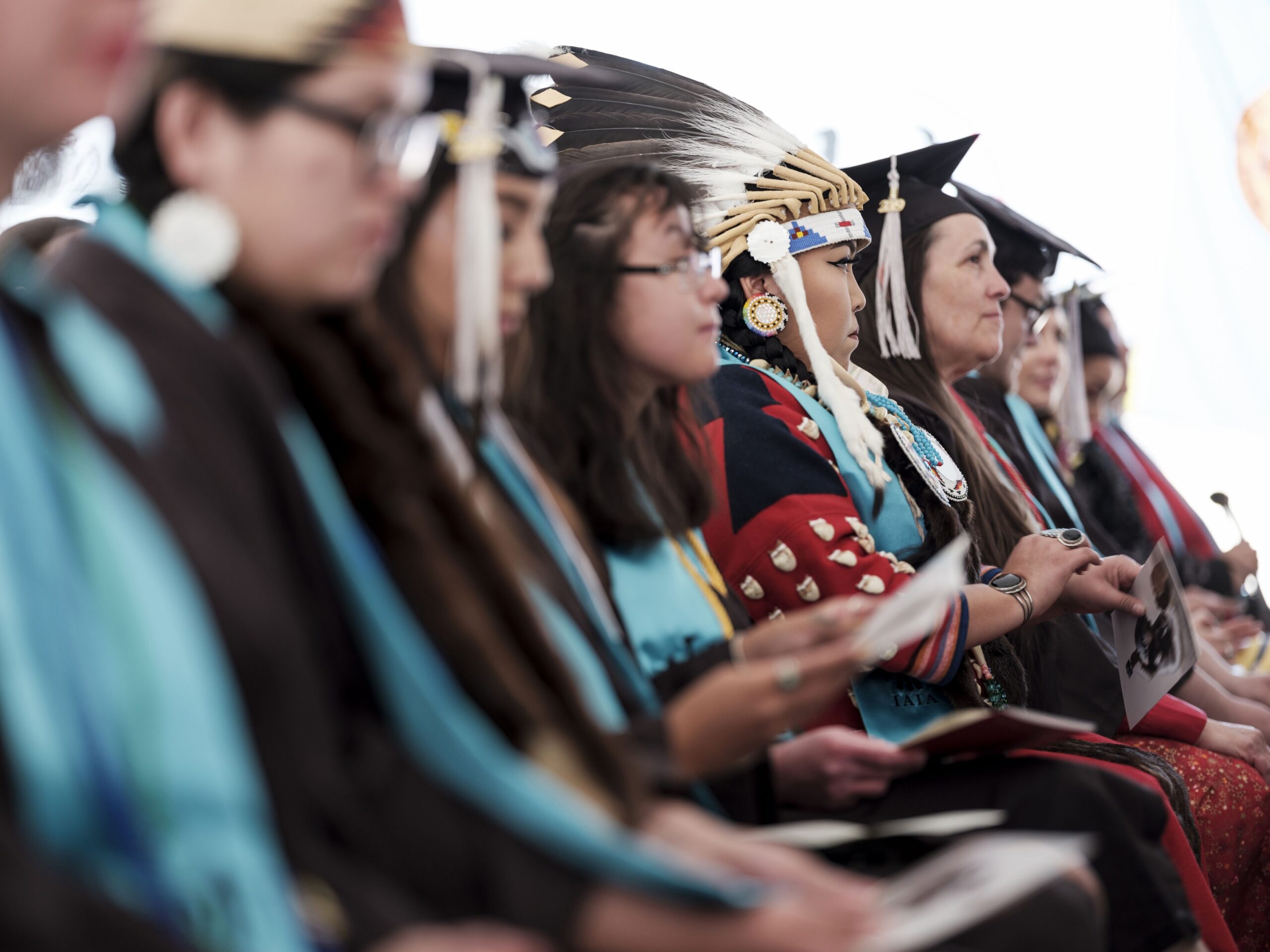 Graduating students participate in the Institute of American Indian Arts commecement ceremony, at the school's campus in Santa Fe, N.M.
