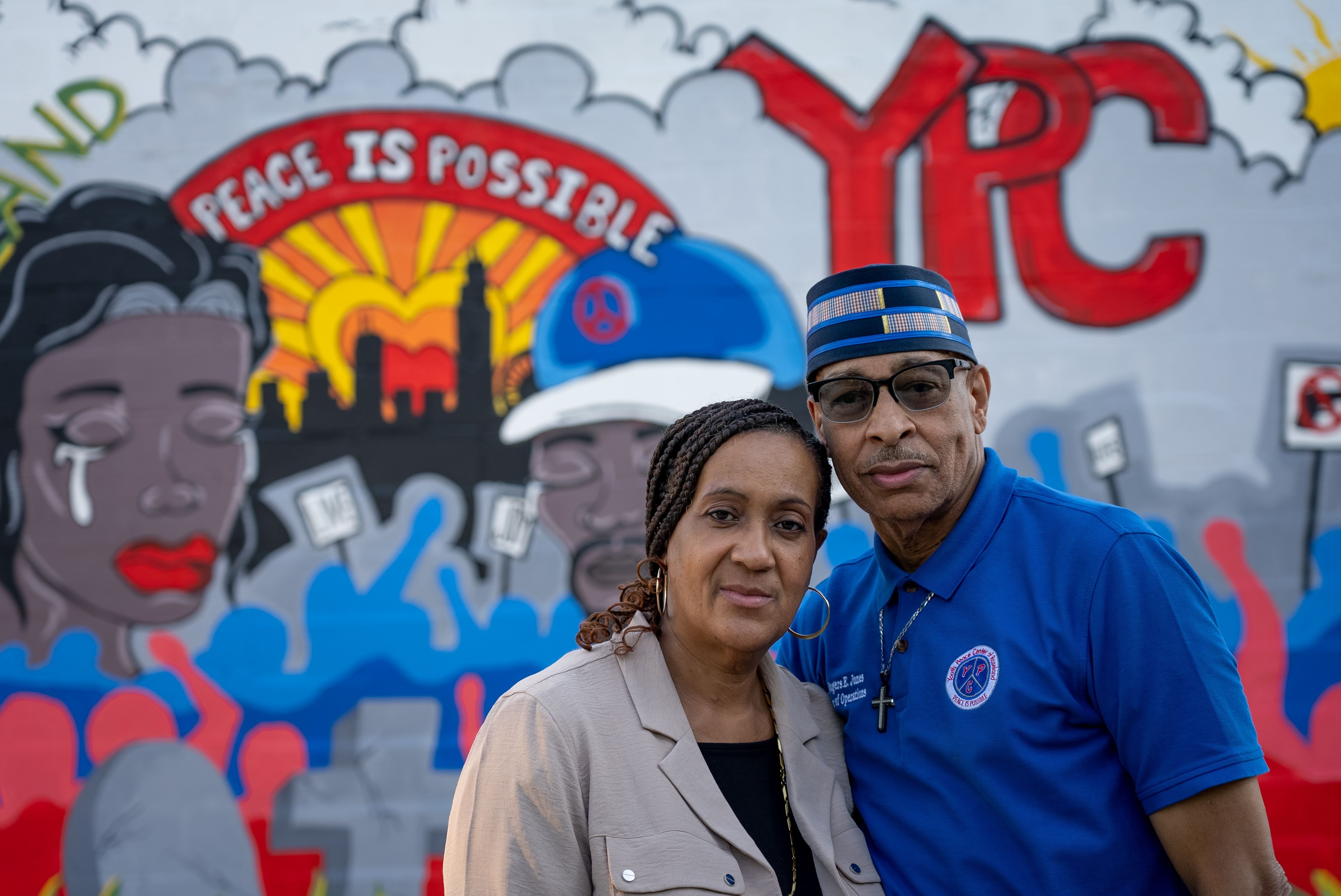 Rogers and Wendy Jones in front of a mural inside a rear courtyard area of The Youth Peace Center of Roseland in Chicago, Thursday, Sep. 8, 2022. A married couple, Wendy serves as executive director and Rogers serves as director of operations.