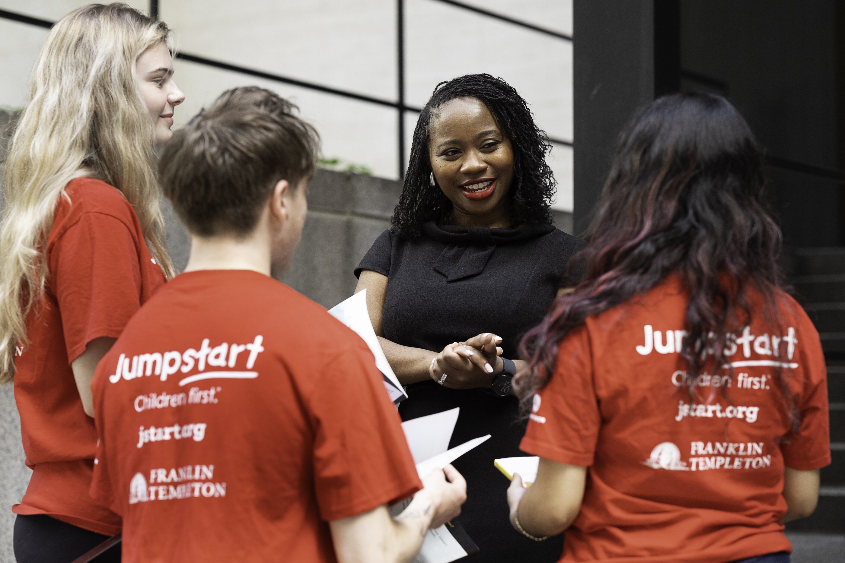 Crystal Rountree, chief executive of Jumpstart, talks with volunteers.