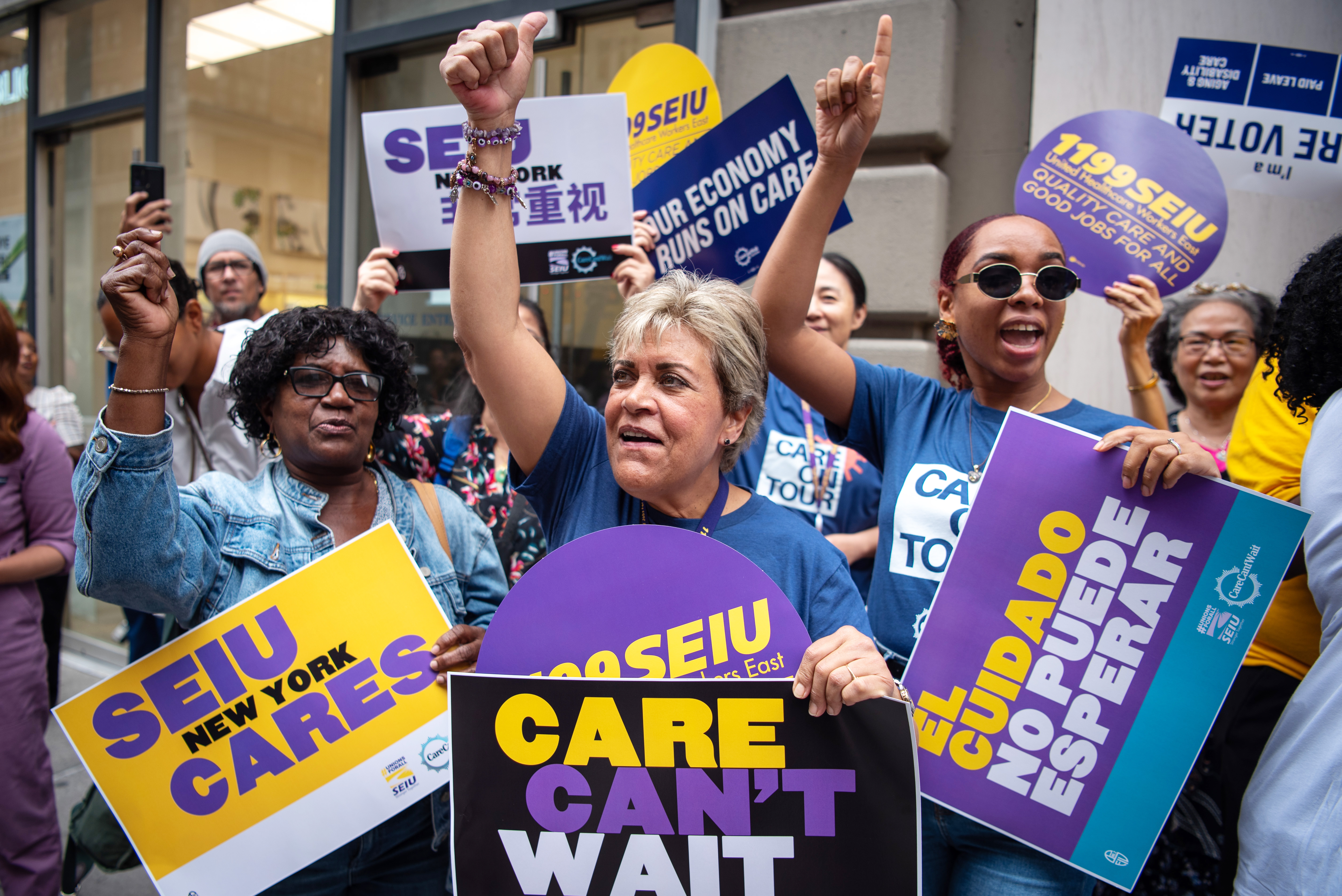 The Care Can’t Wait coalition rallies in New York City during a seven-state bus tour in August 2024. At events in each state, speakers called for access to affordable care and good jobs for care workers.