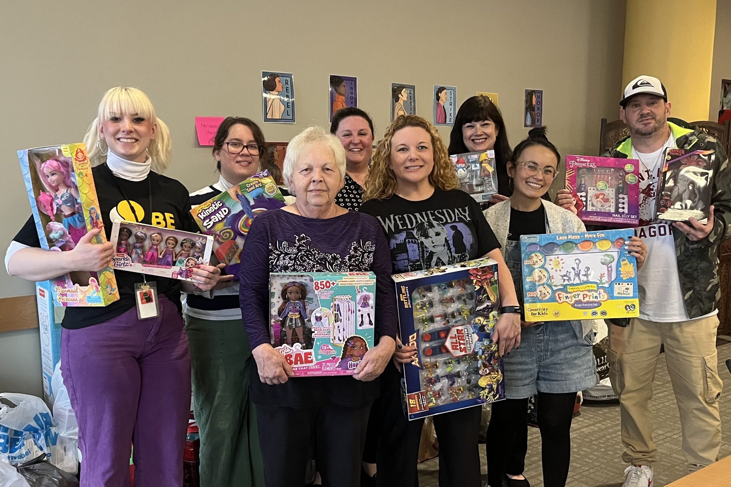 The Krek Family dropped off their annual holiday donations in memory of their beloved daughter and sister, Mikie, and her unborn son, Logan. Receiving the donations are Nicole Molinaro, president and CEO of the Women's Center & Shelter of Greater Pittsburgh, and members of the Development Team.