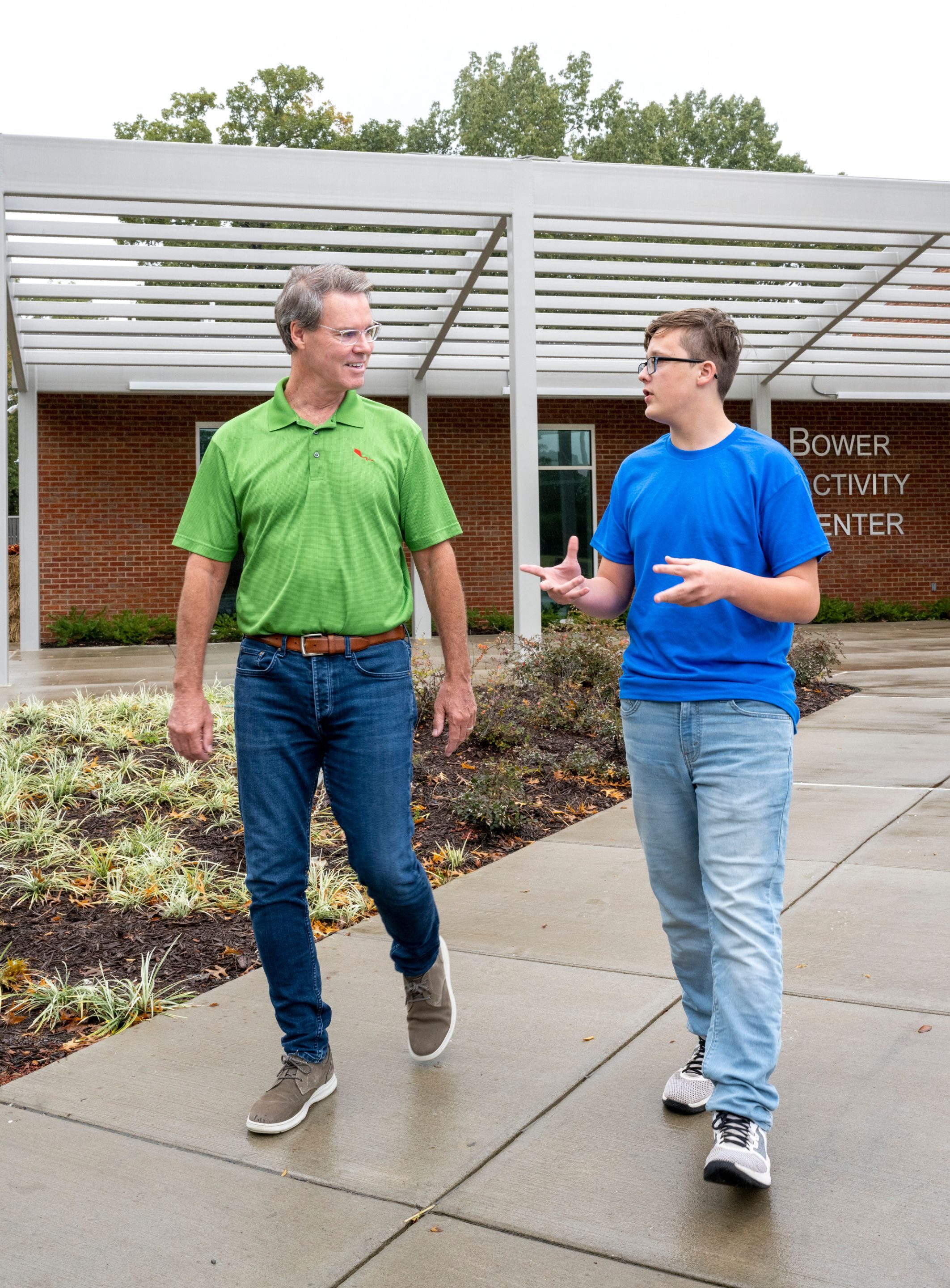Pat Lawler walks with Lance Glover