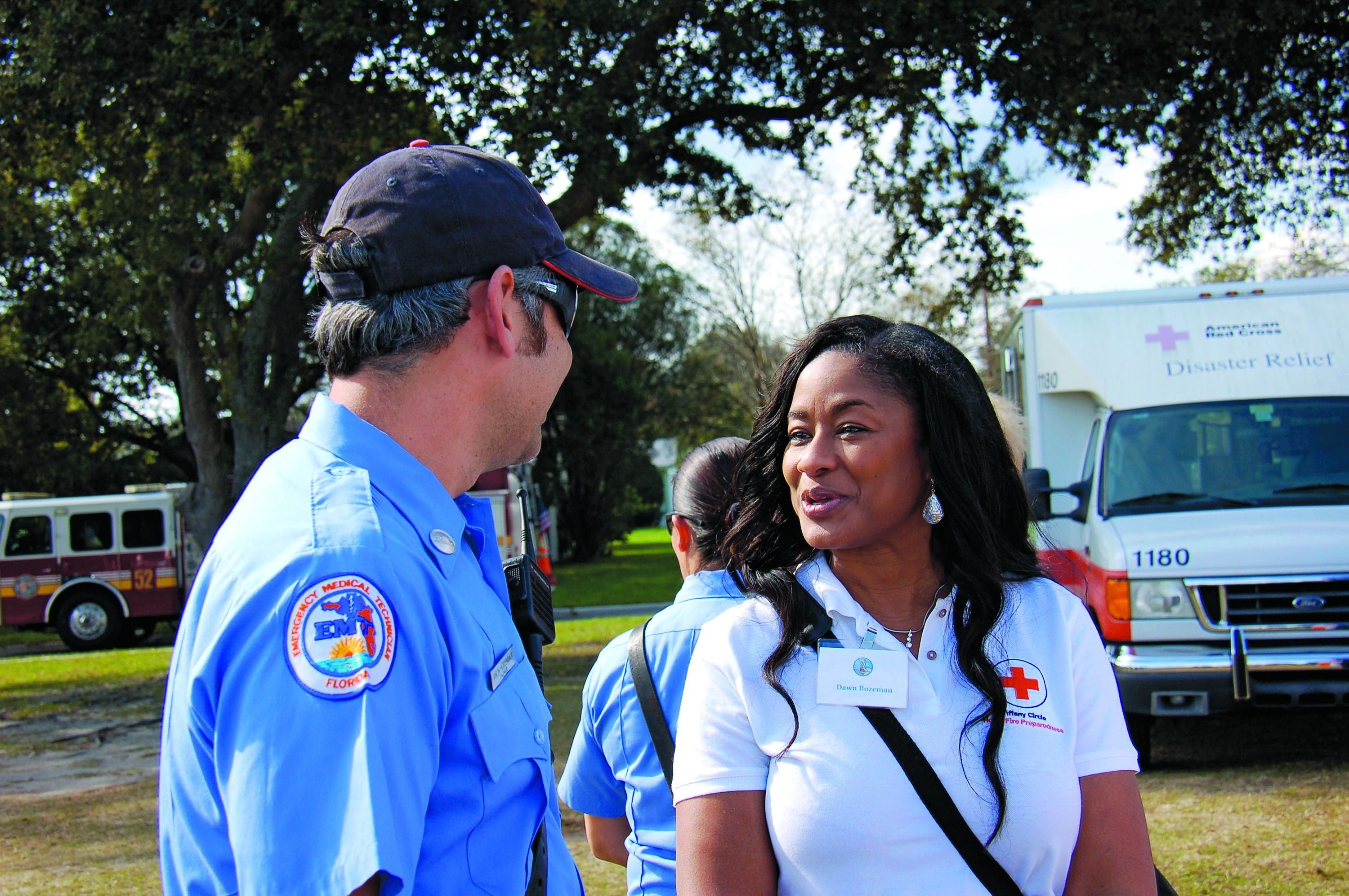 ON THE JOB — AND GIVING: Dawn Bozeman works with emergency personnel to install smoke detectors. She is a member of a Red Cross women’s-giving circle that raised $7.7 million last year, more than two-and-a-half times what it collected in 2007.