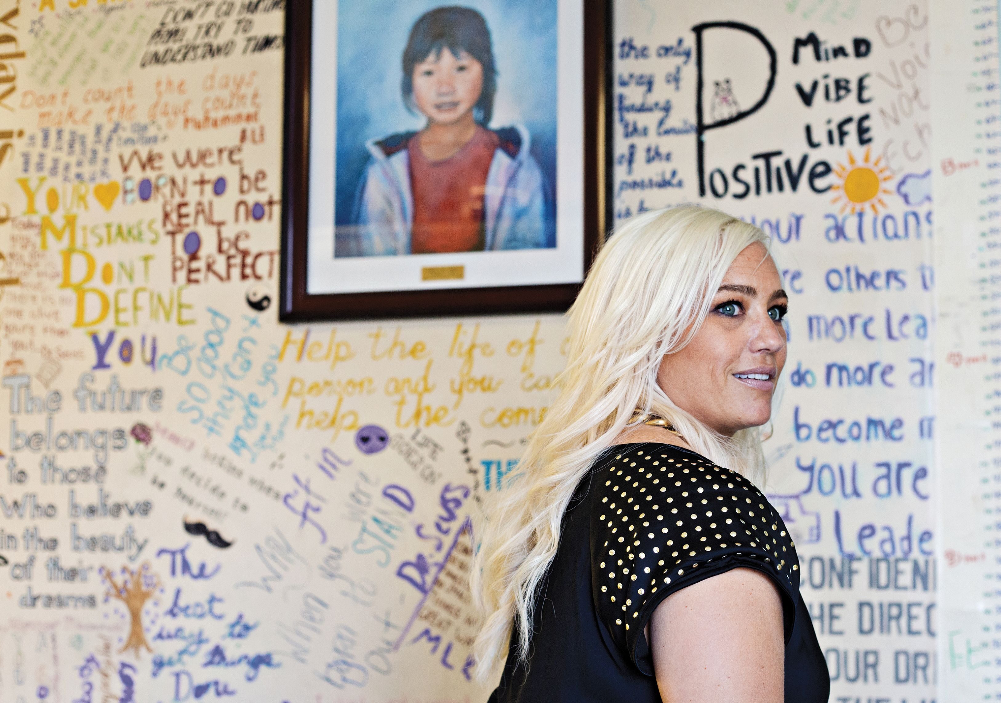 IN HER NAME: United Way of Salt Lake’s Zenia Frendt leads the charity’s Women’s Leadership Council, which paid to open this community center in an apartment complex that’s home to many refugees. The center features a painting of its namesake, Hser Ner Moo, a Burmese girl murdered in the complex.
