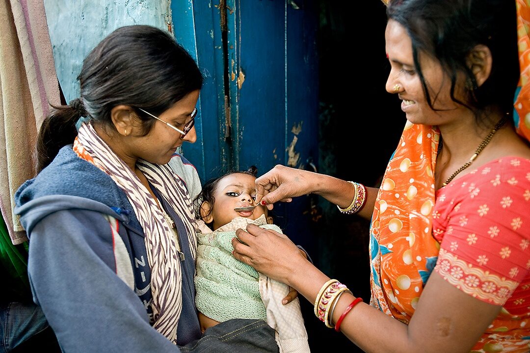 An Indian toddler receives a vitamin treatment at a Save the Children clinic in New Delhi. Foundations and charities with international programs warn that Trump administration plans to slash federal foreign-aid spending could compromise work on global health, poverty, peacemaking, and other issues.