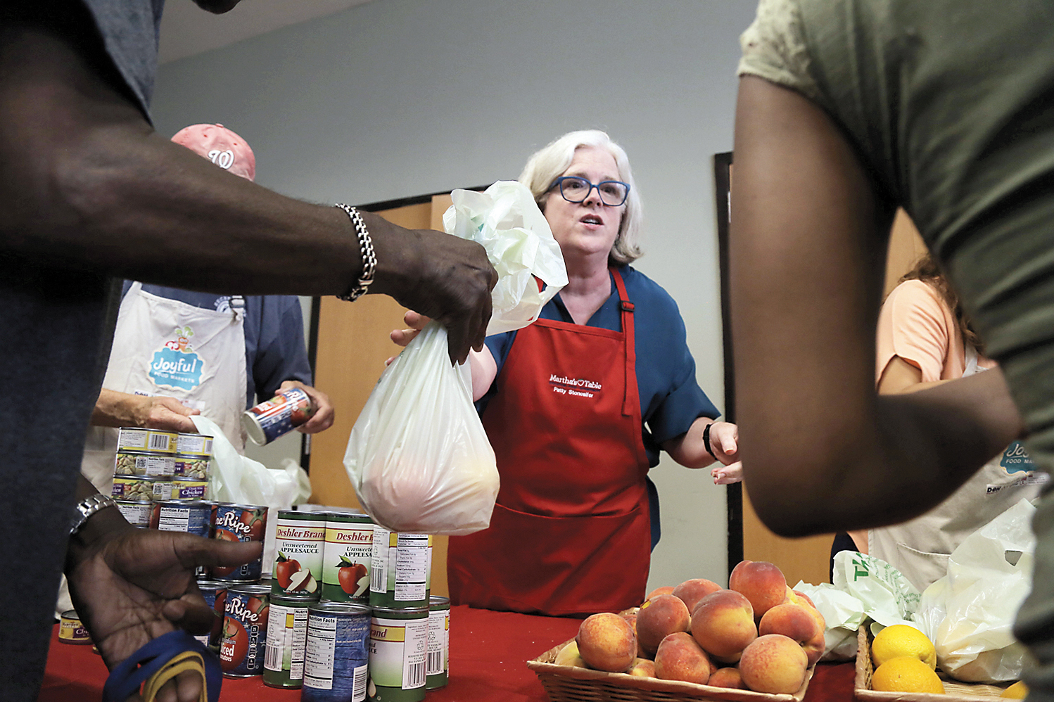 Patty Stonesifer helped create the Joyful Food Market, which offers a shop-like setting where people can make their own food choices instead of being handed a bag filled by someone else.