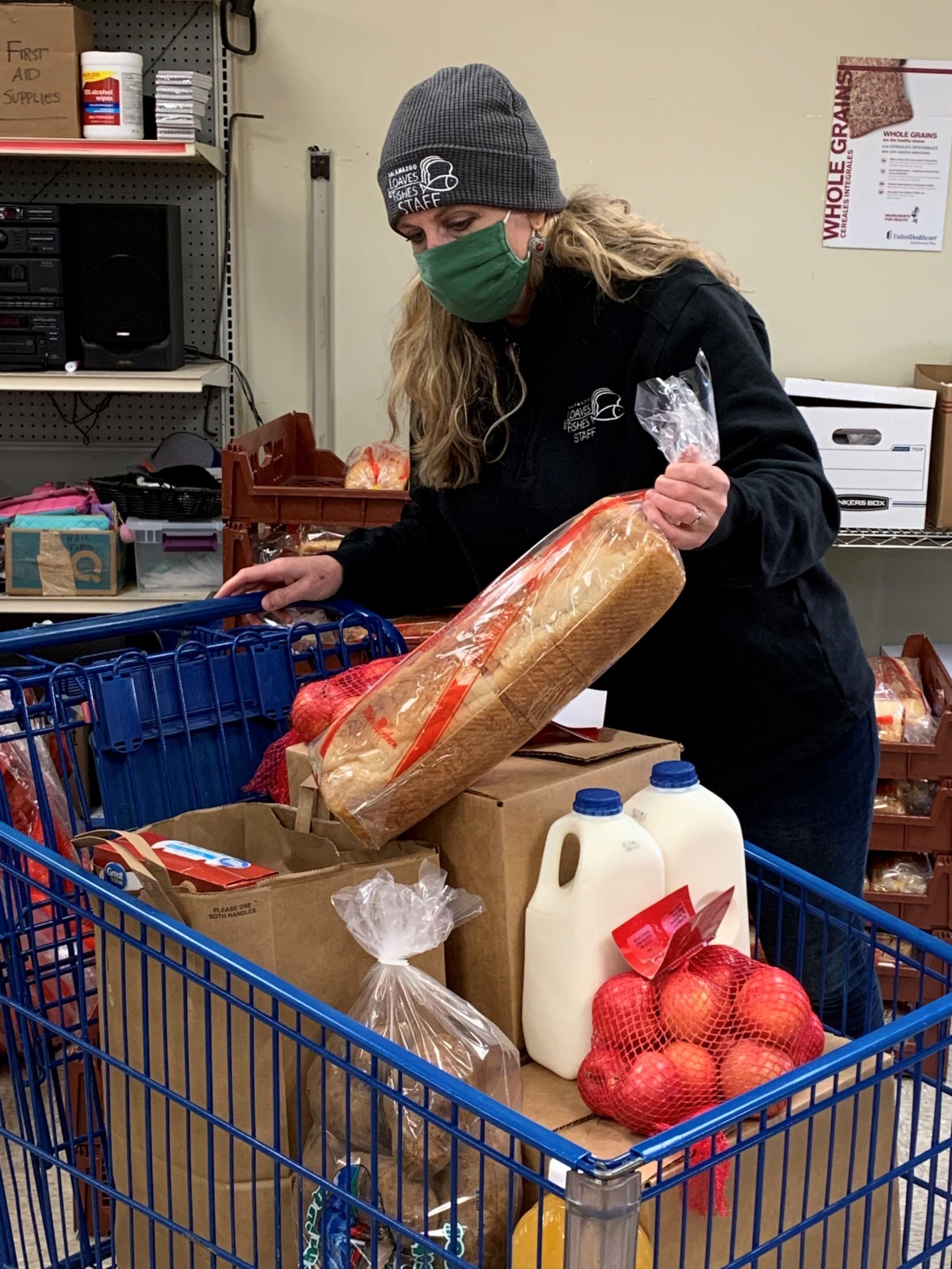 For months, Greta Faworski, the chief fundraiser at Kalamazoo Loaves and Fishes, did development work at night after long days unloading deliveries and packing groceries for people in need.
