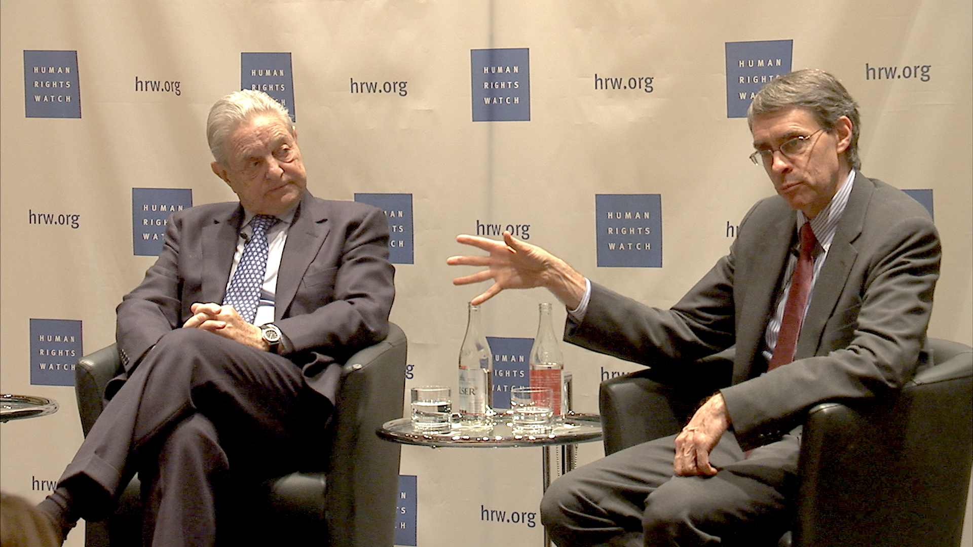 George Soros and Kenneth Roth speak at an event
