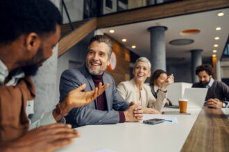 people talking at a desk