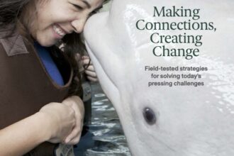 A woman with a dolphin On the cover: How nonprofits are tackling today's most pressing challenges, from winning over Gen Z donors to building partnerships that last.